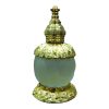 round glass and metal bottle